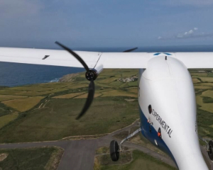 UAV flying in the air over fields and roads