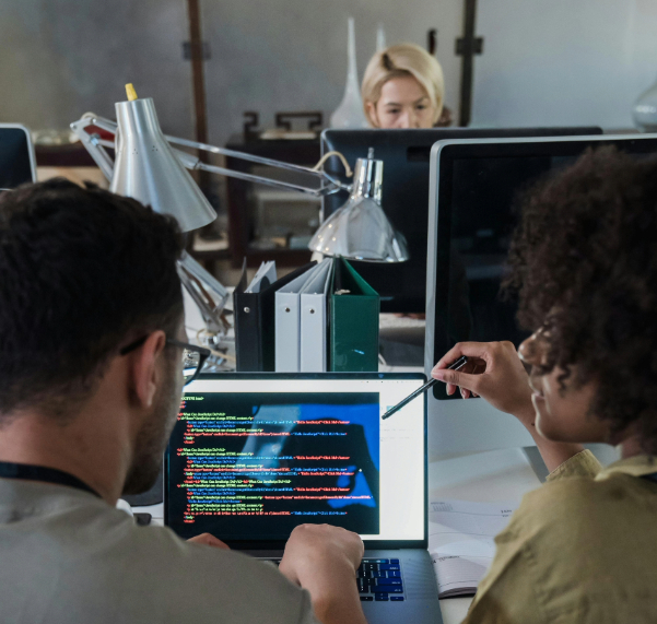 Software developers looking at code together
