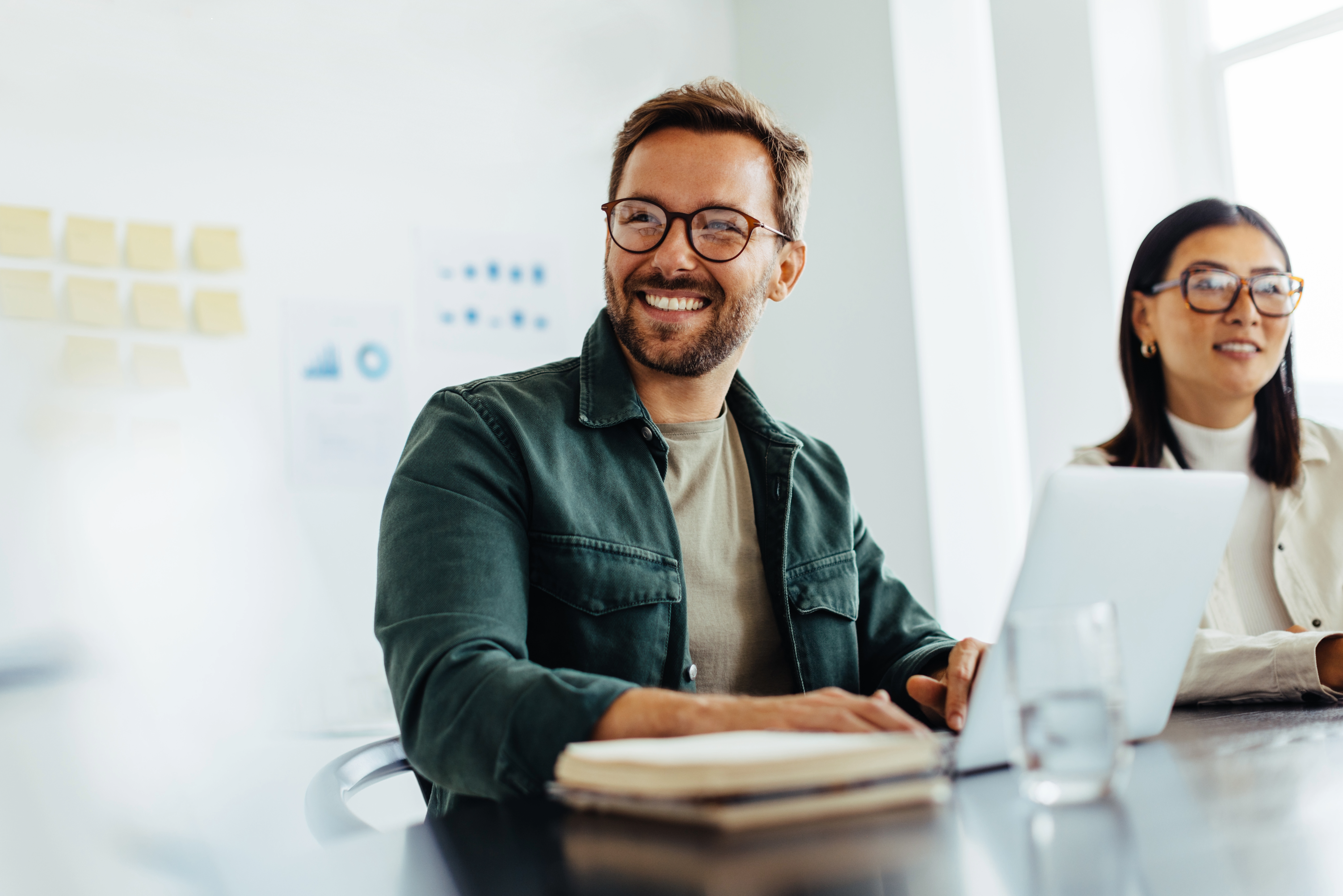 Employees smiling at meeting